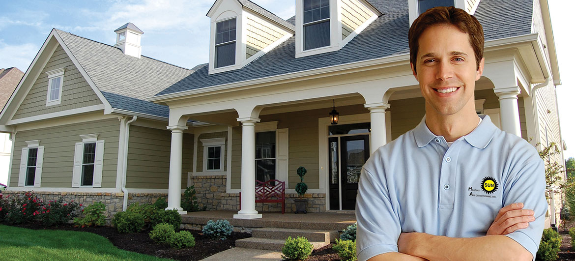 Service man standing in front of a home